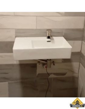 Hoe plaats ik een wastafel?
